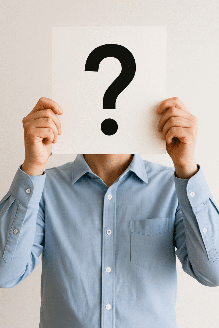 Person holding question mark sign.